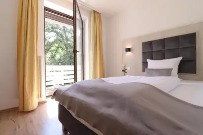 Ein Bett oder Betten in einem Zimmer der Unterkunft Hotel Kurparkblick inkl Therme und Sauna Eintritt