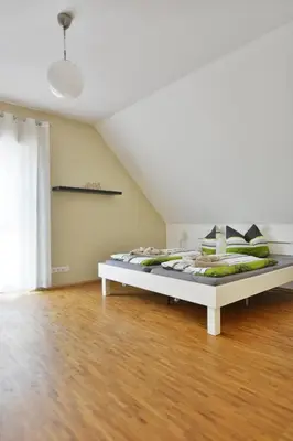 Ein Bett oder Betten in einem Zimmer der Unterkunft Rieslingstube bei Britta & Joachim