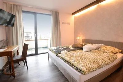Ein Bett oder Betten in einem Zimmer der Unterkunft Vinotel Dollt-Kern