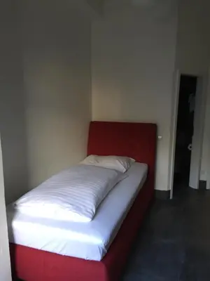 Ein Bett oder Betten in einem Zimmer der Unterkunft Wasserturm Hotel Mannheim