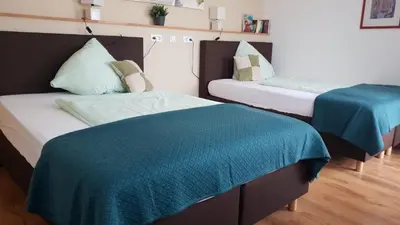 Ein Bett oder Betten in einem Zimmer der Unterkunft Kraft Hotel Alzey Worms A61