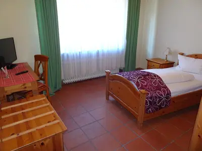 Ein Bett oder Betten in einem Zimmer der Unterkunft Hotel & Weinstube Restaurant Filling