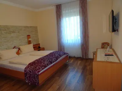 Ein Bett oder Betten in einem Zimmer der Unterkunft Hotel & Weinstube Restaurant Filling