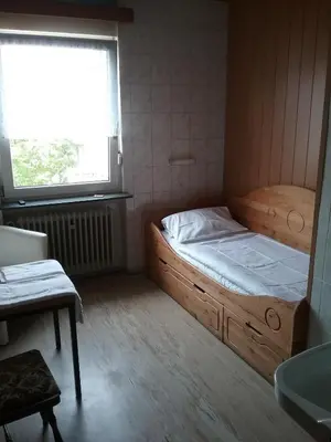 Ein Bett oder Betten in einem Zimmer der Unterkunft See Lord Hotel