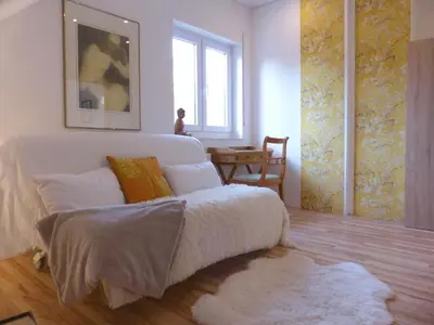Ein Bett oder Betten in einem Zimmer der Unterkunft Ferienwohnung-Monte-Noble-I-Suedpfalz