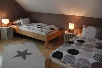Ein Bett oder Betten in einem Zimmer der Unterkunft Ferienwohnung Stadtidyll