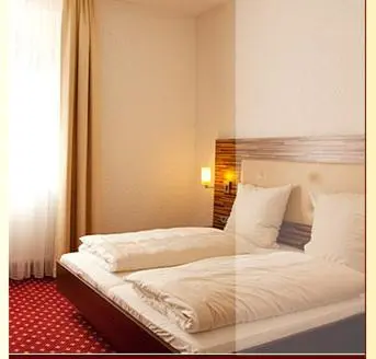 Ein Bett oder Betten in einem Zimmer der Unterkunft Hotel- Restaurant Poststuben