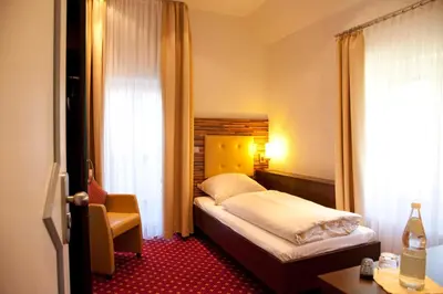 Ein Bett oder Betten in einem Zimmer der Unterkunft Hotel- Restaurant Poststuben