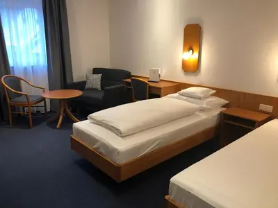 Ein Bett oder Betten in einem Zimmer der Unterkunft Gasthof Zur Krone Garni