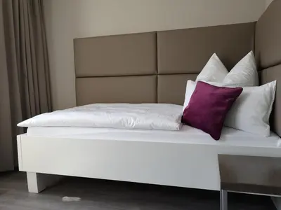 Ein Bett oder Betten in einem Zimmer der Unterkunft Trip Inn PostApart Aschaffenburg