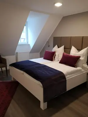 Ein Bett oder Betten in einem Zimmer der Unterkunft Trip Inn PostApart Aschaffenburg