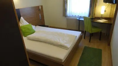 Ein Bett oder Betten in einem Zimmer der Unterkunft Gasthof Krone