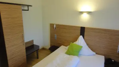 Ein Bett oder Betten in einem Zimmer der Unterkunft Gasthof Krone