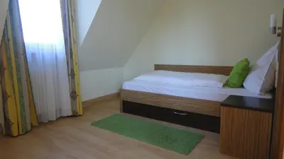 Ein Bett oder Betten in einem Zimmer der Unterkunft Gasthof Krone
