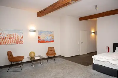 Ein Bett oder Betten in einem Zimmer der Unterkunft Klosterhof Weingut BoudierKoeller