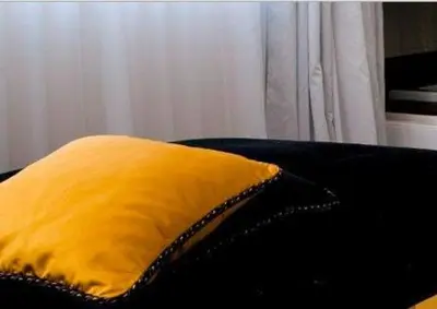 Ein Bett oder Betten in einem Zimmer der Unterkunft Schlosshotel Bergzaberner Hof