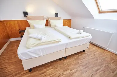 Ein Bett oder Betten in einem Zimmer der Unterkunft ERCK- Hotel & Gastronomie