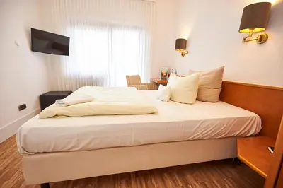 Ein Bett oder Betten in einem Zimmer der Unterkunft ERCK- Hotel & Gastronomie