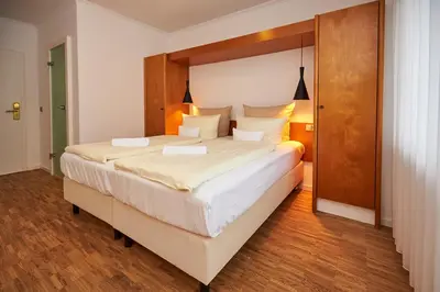 Ein Bett oder Betten in einem Zimmer der Unterkunft ERCK- Hotel & Gastronomie