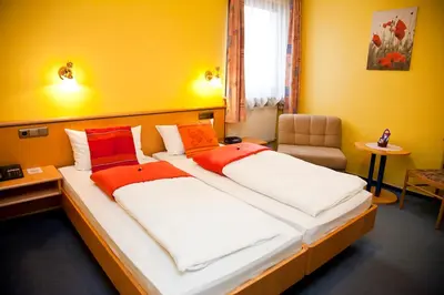 Ein Bett oder Betten in einem Zimmer der Unterkunft Hotel bei Liebe's