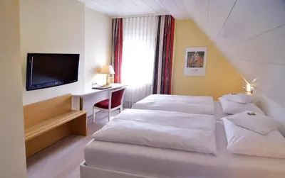 Ein Bett oder Betten in einem Zimmer der Unterkunft Hotel - Restaurant Hirsch