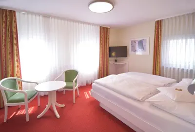 Ein Bett oder Betten in einem Zimmer der Unterkunft Hotel - Restaurant Hirsch