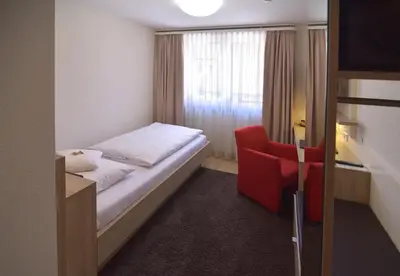 Ein Bett oder Betten in einem Zimmer der Unterkunft Hotel - Restaurant Hirsch