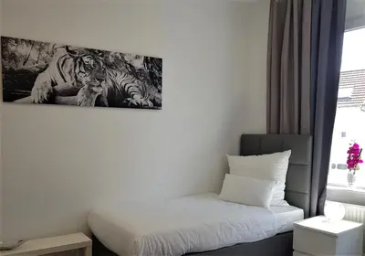 Ein Bett oder Betten in einem Zimmer der Unterkunft Hotel Schützen