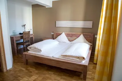 Ein Bett oder Betten in einem Zimmer der Unterkunft Landhotel Battenheimer Hof