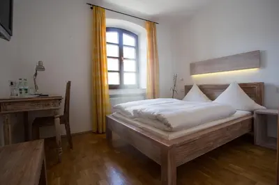 Ein Bett oder Betten in einem Zimmer der Unterkunft Landhotel Battenheimer Hof
