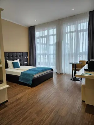 Ein Bett oder Betten in einem Zimmer der Unterkunft RheinCity Hotel & Boardinghouse