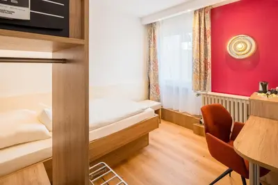 Ein Bett oder Betten in einem Zimmer der Unterkunft Hotel Erbprinzenhof