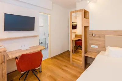 Ein Bett oder Betten in einem Zimmer der Unterkunft Hotel Erbprinzenhof