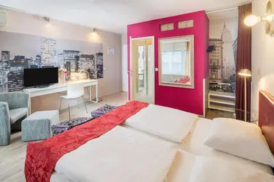 Ein Bett oder Betten in einem Zimmer der Unterkunft Hotel Erbprinzenhof