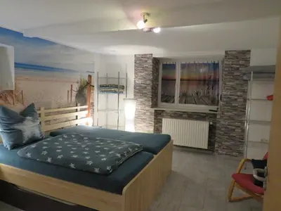 Ein Bett oder Betten in einem Zimmer der Unterkunft Die Ferienwohnung in Lörzweiler