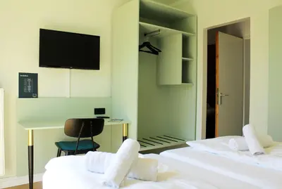 Ein Bett oder Betten in einem Zimmer der Unterkunft Autobahn Hotel Pfungstadt Ost
