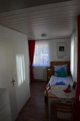 Ein Bett oder Betten in einem Zimmer der Unterkunft Gasthaus Löwen