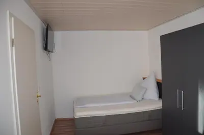 Ein Bett oder Betten in einem Zimmer der Unterkunft Gasthaus Löwen