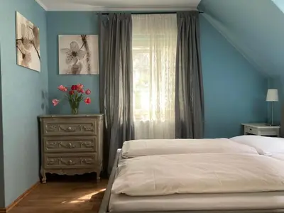 Ein Bett oder Betten in einem Zimmer der Unterkunft Hotel Gästehaus Hochmann Stadecken