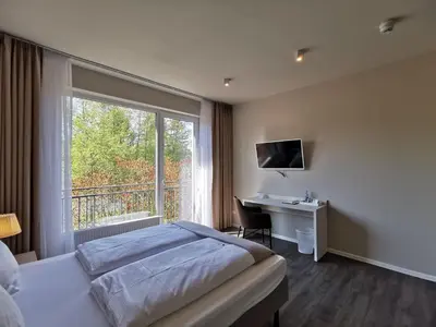 Ein Bett oder Betten in einem Zimmer der Unterkunft Hotel Gutsmühle