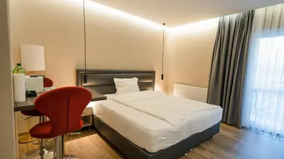 Ein Bett oder Betten in einem Zimmer der Unterkunft Comfort Boardinghouse
