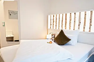 Ein Bett oder Betten in einem Zimmer der Unterkunft Hotel Jungstil