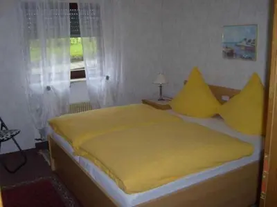 Ein Bett oder Betten in einem Zimmer der Unterkunft Ferienwohnungen Am Limespfad