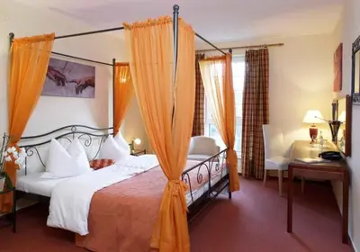 Ein Bett oder Betten in einem Zimmer der Unterkunft Hotel Villa Magnolia