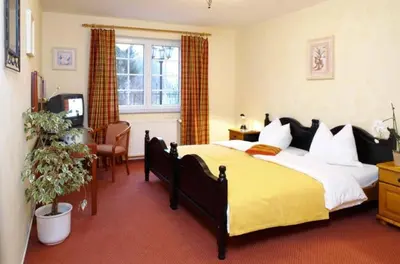 Ein Bett oder Betten in einem Zimmer der Unterkunft Hotel Villa Magnolia