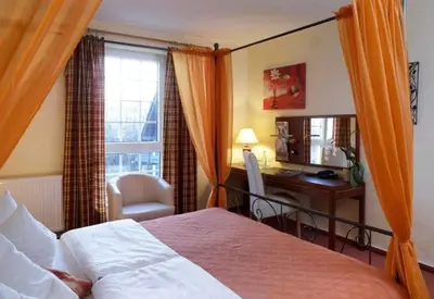 Ein Bett oder Betten in einem Zimmer der Unterkunft Hotel Villa Magnolia