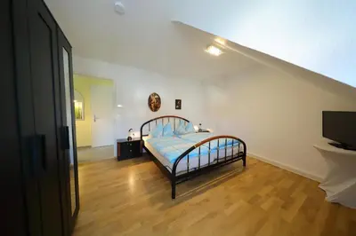 Ein Bett oder Betten in einem Zimmer der Unterkunft Ferienwohnung Biermann