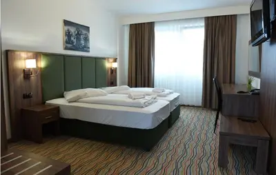 Ein Bett oder Betten in einem Zimmer der Unterkunft Hotel Olive Inn