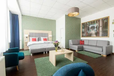 Ein Bett oder Betten in einem Zimmer der Unterkunft Pallas Hotel