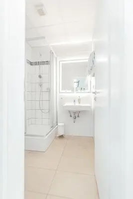 Ein Badezimmer in der Unterkunft Pallas Hotel